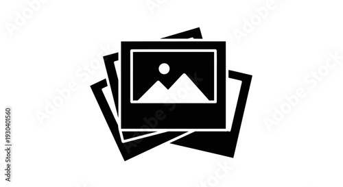 Stack of photos with mountain picture.