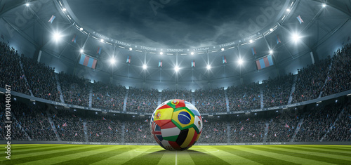 Foto Football with international flags in the stadium at night
