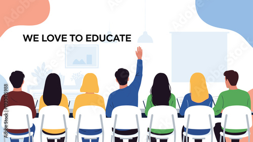 Group of students attending a lecture in a classroom with one person raising their hand to ask a question during an educational session.