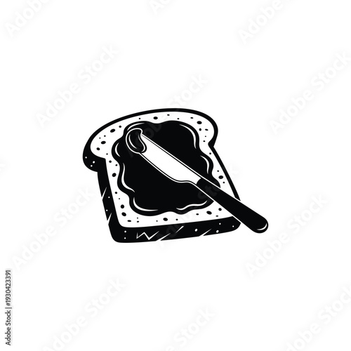 A knife spreading dark jam on a slice of bread with sesame seeds against a clean background