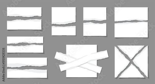 Assorted pieces of white torn paper including strips and squares are arranged on a grey background as textures for creative layouts.