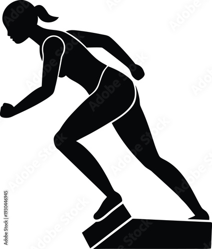 Female athlete sprinting off a starting block