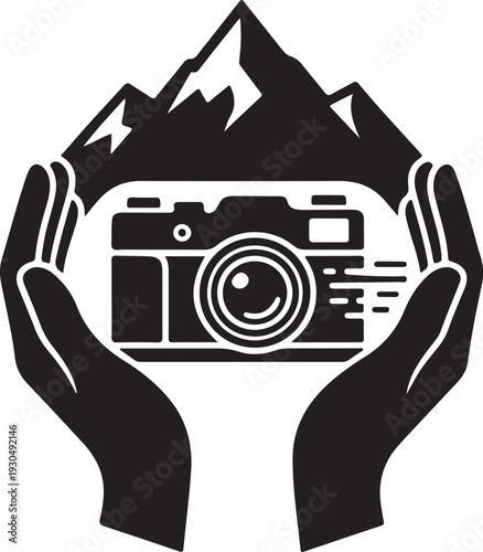 A camera is held up by hands with mountains in the background