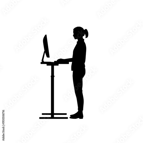 Illustration of silhouette of woman working on computer at standing desk