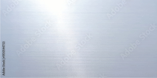 Shiny brushed metal plate texture featuring a polished silver stainless steel surface with a light metallic gray pattern and industrial chrome reflection for a sleek grey aluminum backdrop design