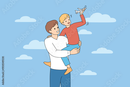 Father And Boy Enjoy Imaginary Airplane Journey. Father Shares Joyful Pretend Flight With His Son