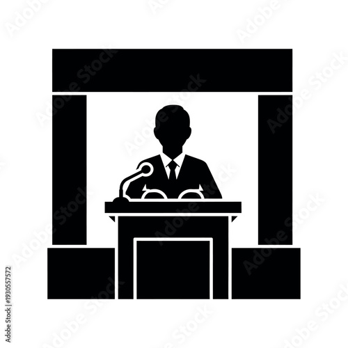 Speaker at a podium giving a speech.