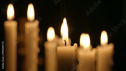 Glowing candles illuminate the darkness, symbolizing hope and profound reflection for Good Friday 2026, a solemn and significant observance