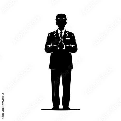 Silhouette of a professional chauffeur or hotel staff in formal uniform performing a traditional greeting with hands together