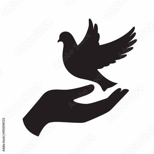 Silhouette of a hand releasing a dove into the air symbolizing freedom