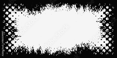 A stark rectangular frame of splattered black ink on white background