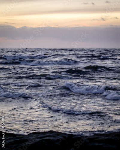 Ocean Waves at Sunset with Dramatic Clouds