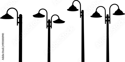 Black outdoor lamp posts with single and double lights