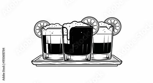 Three dark beverages in shot glasses with frothy tops and lime slices