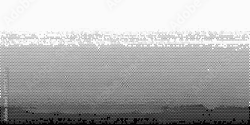 Gradient of halftone dots transitioning from dark to light tones