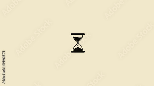 A minimalist image of a black hourglass, representing time, on a neutral yellow-beige background