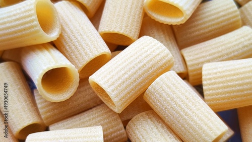 Canvas-taulu mezzi rigatoni pasta texture closeup view abstract wheat staple food background