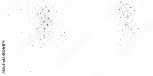 Abstract white texture with scattered dark specks and grainy details