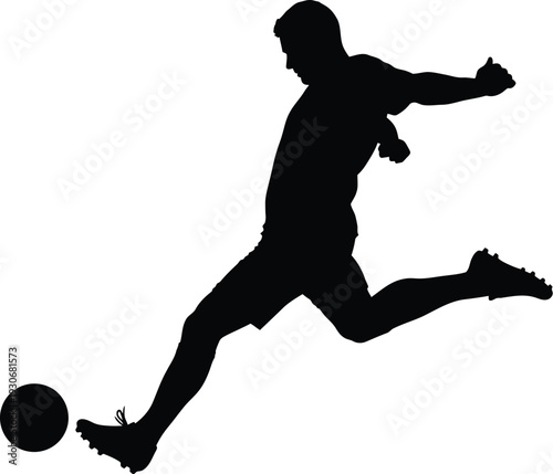 Silhouette of a powerful male soccer player fiercely kicking a round ball during a dynamic field match.