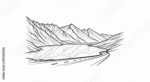 Winding road curves by a tranquil lake reflecting majestic mountain peaks