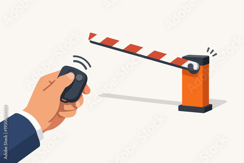 Hand holding remote control opening automatic barrier for parking access