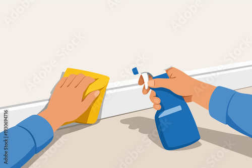 Hands cleaning baseboard molding with spray bottle and scrubbing cloth