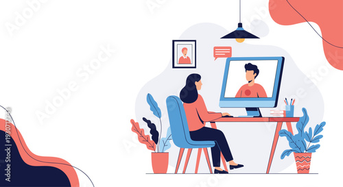 Young woman sitting at her desk having a video call with a man on a desktop computer in a modern home office.