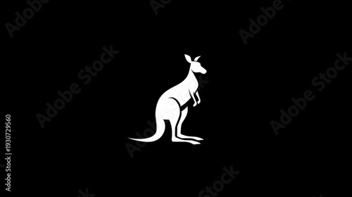 A stark white silhouette of a kangaroo in a standing pose against a black background