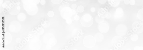 Festive background with shimmering light, bokeh and sparkling stardust.