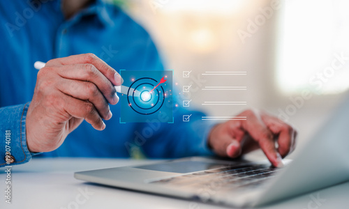 Businessman working laptop computer select target goals strategic for business purpose, goal achievement futuristic innovation for strategic planning. Strategic planning for business target concept.