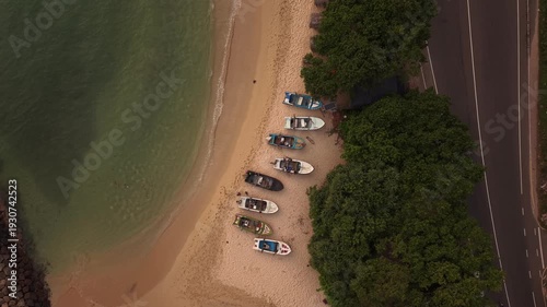 Aerial view of traditional fishing boats floating in clear blue ocean near Sri Lanka coast
