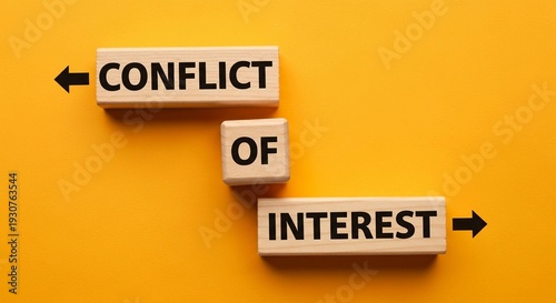 Conflict of interest concept with wooden blocks on yellow background