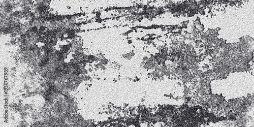 Gritty monochrome abstract texture with irregular dark patches and a speckled white background creating a distressed and organic surface for creative backgrounds