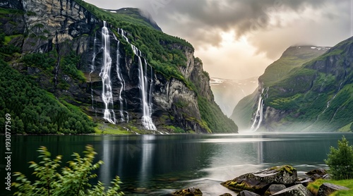 Fjord slopes with thin waterfalls cascading into calm lake, surrounded by green mountains. Concept of natural beauty inspired by Geirangerfjord in Norway.