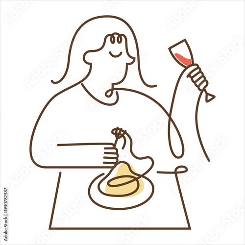 Woman enjoying a glass of wine and a meal alone at a table