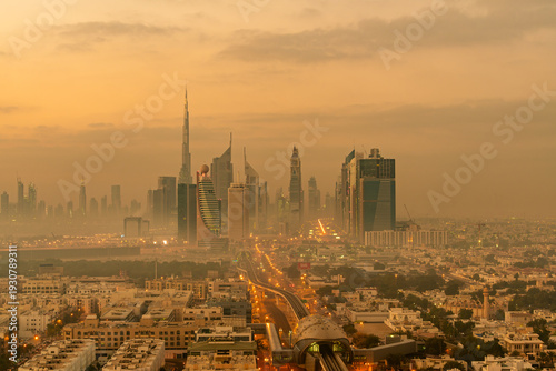 Dusty Dubai skyline with metro train line, United Arab Emirates