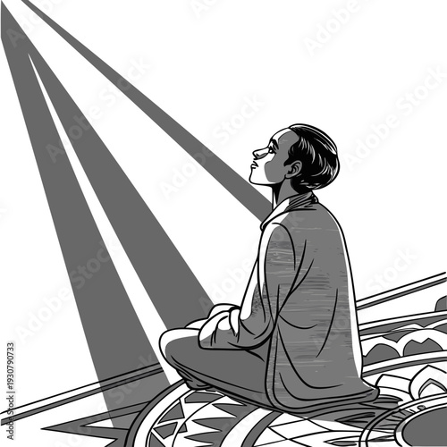 Grayscale of a contemplative man sitting cross-legged on a patterned rug looking up at beams of