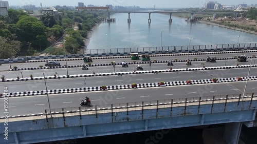 Busy Highway Traffic Near River Bridge in Surat City India Sunny Day Aerial Drone Shot