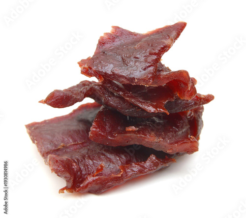 Beef jerky pieces on white background
