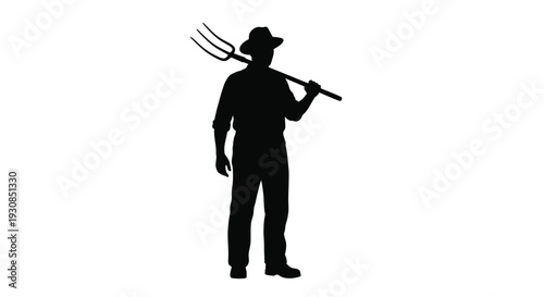 A farmer with a pitchfork stands proudly in dark silhouette