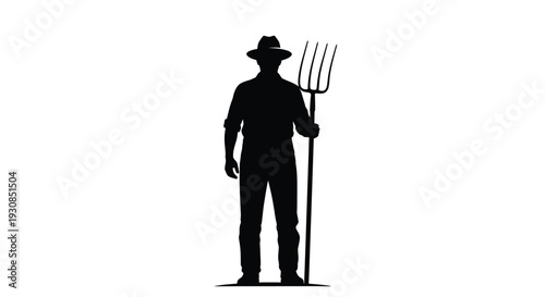A farmer stands with a pitchfork a striking black silhouette