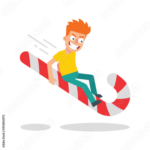 Boy riding a giant candy cane like a snowboard.