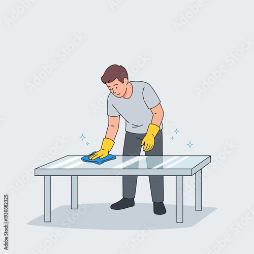 Man Cleaning A Shiny Table With A Cloth And Yellow Gloves