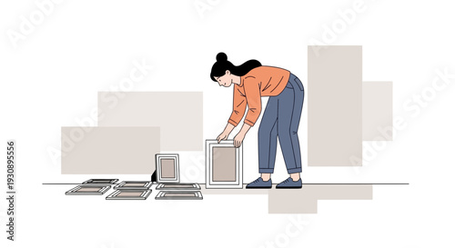 Person Arranging Picture Frames For Home Decor Display