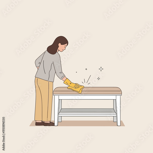 Person Sanitizing Furniture with Cloth and Gloves for Hygiene