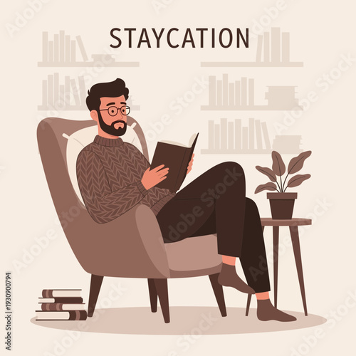 Relaxing Bearded Man Enjoys Staycation Reading Book In Comfortable Armchair, Indoor Scene