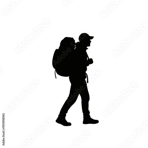 Silhouette of a hiker with backpack walking along a trail in rugged outdoor scenery.