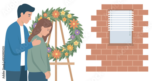 Man comforts sad woman next to floral wreath on a stand, offering emotional support during a difficult time of grief.