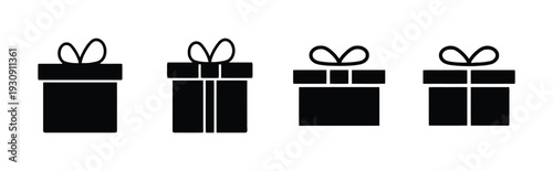 Group of black gift boxes with ribbons, symbolizing presents and celebrations