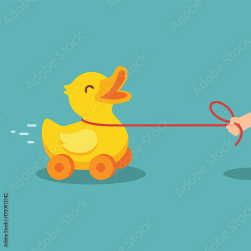 Cute yellow duck toy on wheels being pulled by a string.